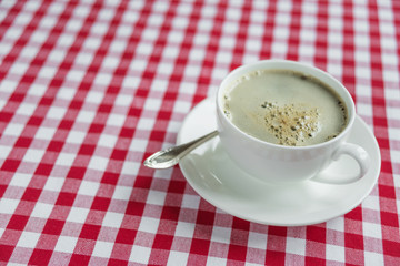 Black coffee in a white porcelain cup