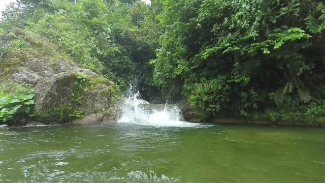 Experienced canyoning instructor accidentally plunges into a picturesque small waterfall due to a jump error,offering thrilling adventures for adrenaline seekers.
