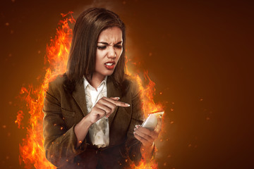 Business woman angry looking cellphone
