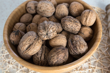 Wooden dish with walnuts,