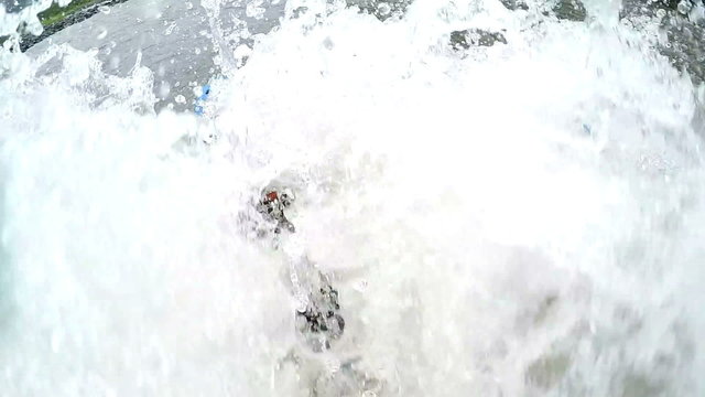 Experience the adrenaline rush as a massive wave crashes into a whitewater rafting boat,capturing the thrilling moment in stunning 120fps slow motion from an on board camera.