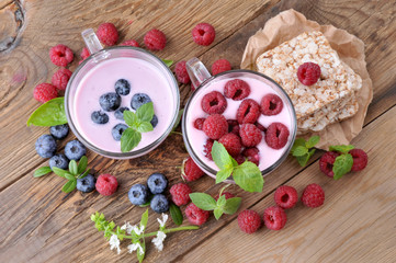 Breakfast. Yogurt and berries blueberries and raspberries, slices with jam.Healthy eating.