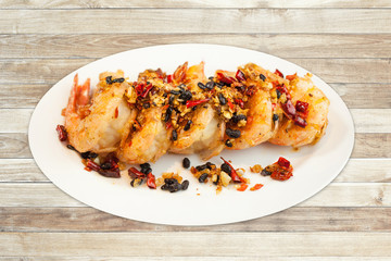 Fried shrimp with spices on dish