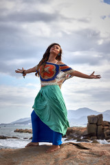 ethnic fashion photo, beautiful sensual girl, bright clothes, ocean beach