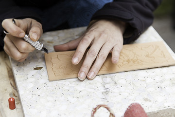 Leather working hands