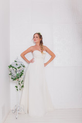 Fototapeta premium Beautiful bride blond girl in a wedding dress