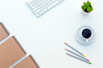 White working Desk with Business Items Coffee and Sketch Books