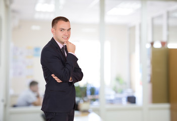 One Man in Business Style Clothing at Office Interior