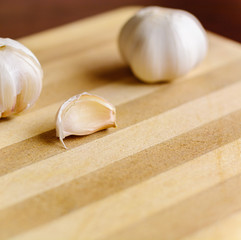 brown Garlic on the bamboo wooden background
