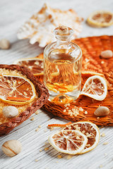 Composition of spa treatment on wooden background. Essential cit