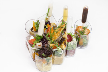 mini canape with meat and vegetables on a white background seafood