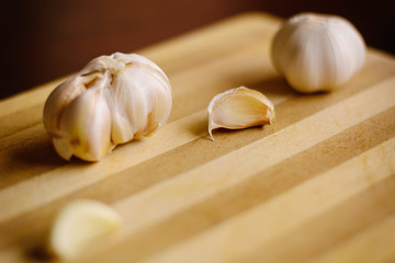brown Garlic on the bamboo wooden background