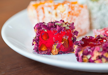 Turkish delight  Rahat Lukum on a white plate, Istanbul, Turkey. Selective focus. Close up.