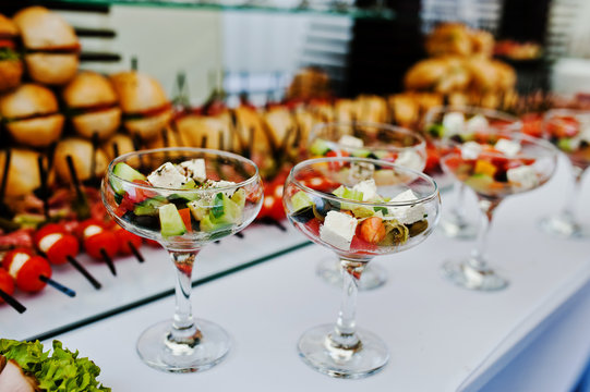 Glasses with Greek salad on reception