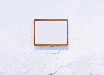 Blank Wooden Photo Frame on white textured wall Background