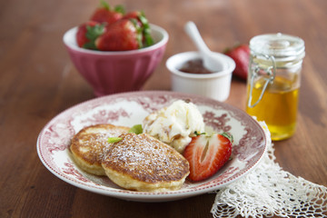 Pancakes with berries and ice cream