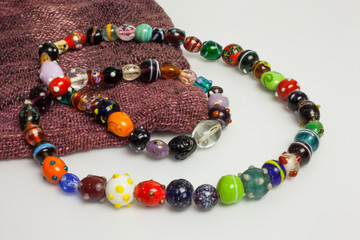 Necklace made ​​of beads and multi-colored hand-made .