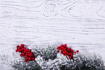 Christmas wooden background with snow fir tree.