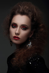 Naklejka premium Portrait of a woman with high hair and red lips.