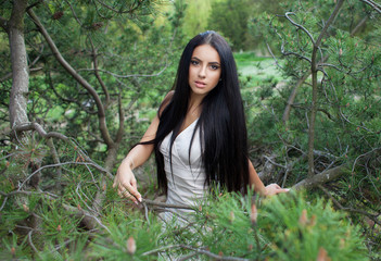 Beautiful  brunette  young woman in park