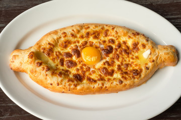 Khachapuri, raditional Georgian cheese-filled bread Ajarian style