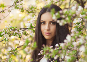 Beautiful  brunette  young woman in park