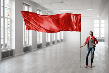 Woman holding red flag