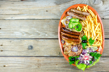 Mixed grilled meats on a plate