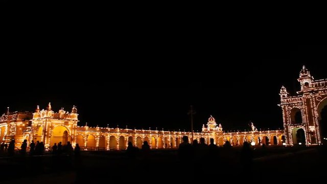 Pan shot of Mysore Palace lit up at night, Mysore, Karnataka, India