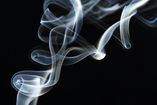 Movement of smoke on a black background.
