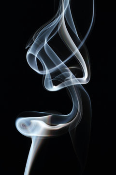 Movement of smoke on a black background.
