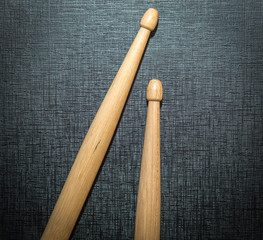 Wood Drumsticks in black texture background