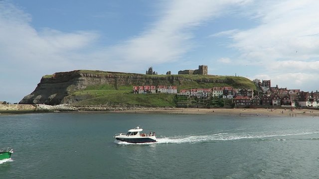 Small boats sail on the River Esk at Whitby