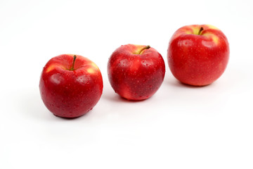 Fototapeta na wymiar three red apple on white background