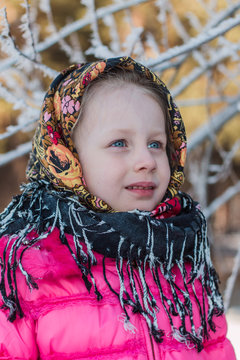 portrait of a girl in a scarf winter day Pavloposadskiye