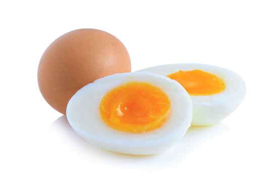 Boiled eggs cut in half isolated on white background.