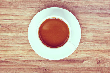 top view of coffee white cup on wooden background