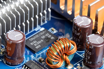 Close-up of inductors, capacitors, cooler and chips