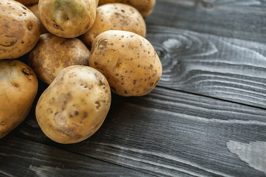 potatoes on wooden rustic background