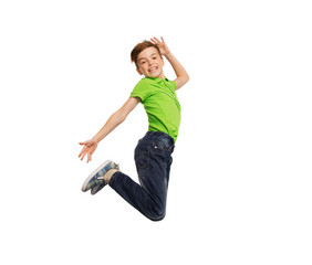 smiling boy jumping in air