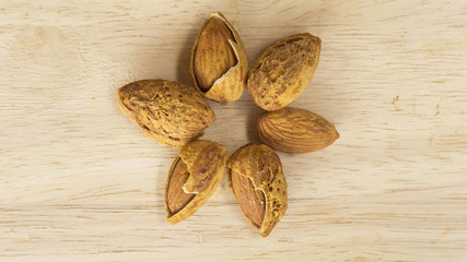 Almonds on wood background