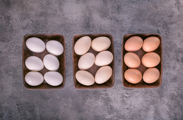 Three bowls with eggs above
