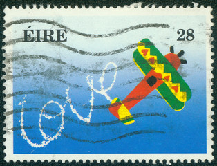 stamp printed in Ireland shows Plane and Word Love in the Sky
