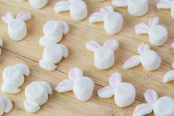 Fototapeta na wymiar Cut marshmallows for easter bunny cake decoration.