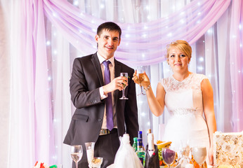 Bride And Groom Enjoying Meal At Wedding Reception