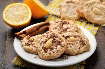 Almond cookies on white plate, close up view