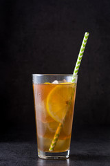 Ice tea with lemon. Black stone
