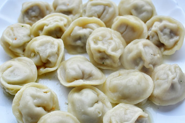 Boiled prepared homemade russian dumplings or pelmeni