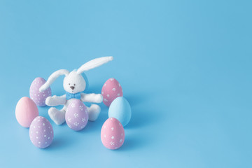 rabbit with Easter eggs on blue