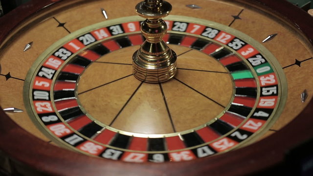 Casino: Roulette in motion, ball stops at black thirteen